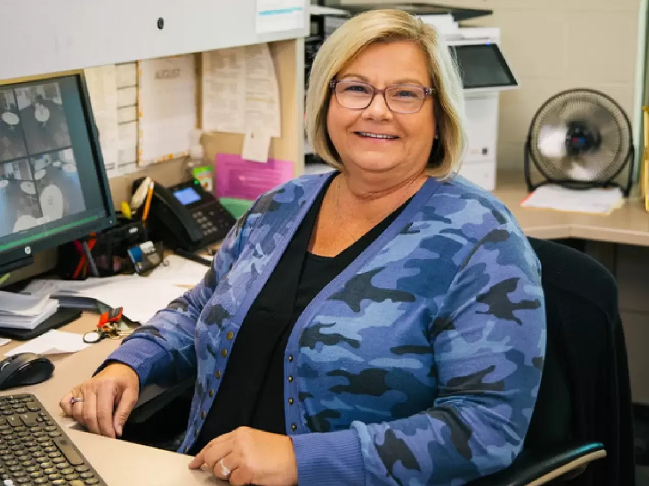 woman similing in an office