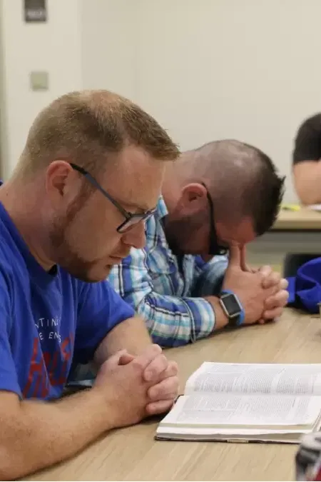 men praying at a Bible study