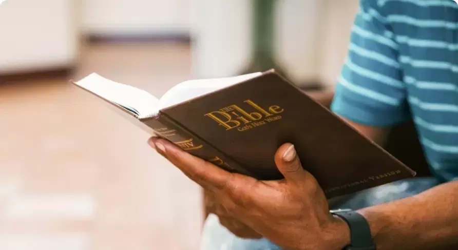 man holding a bible