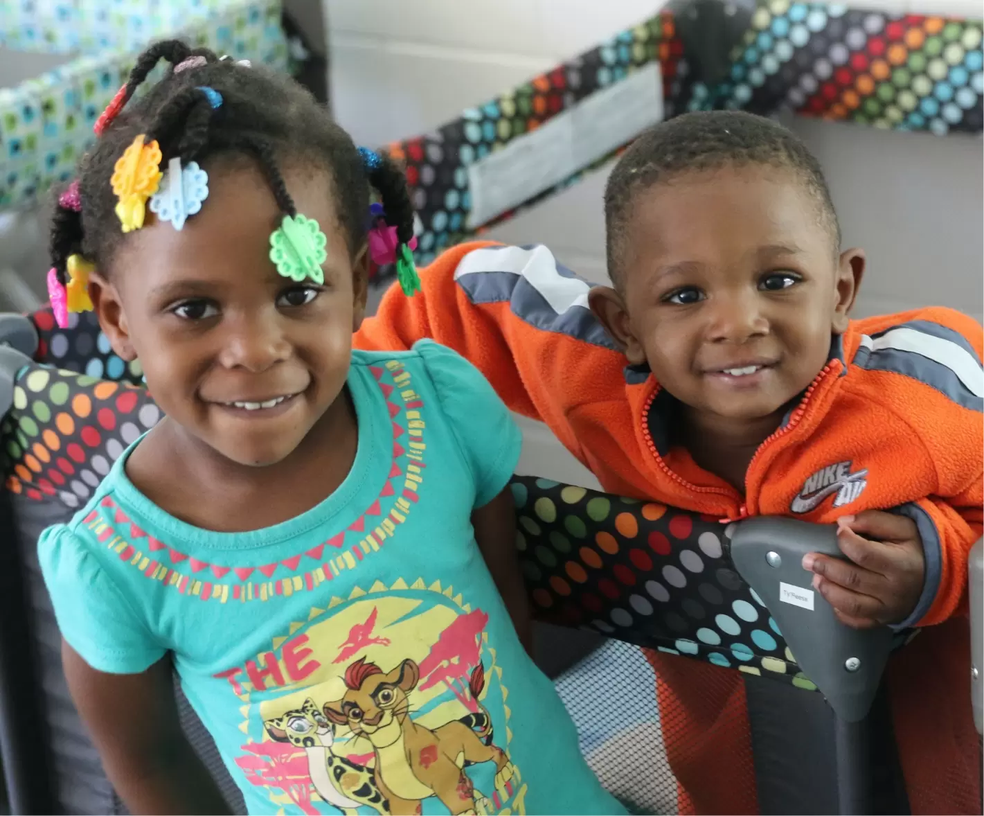 A boy and a girl smiling