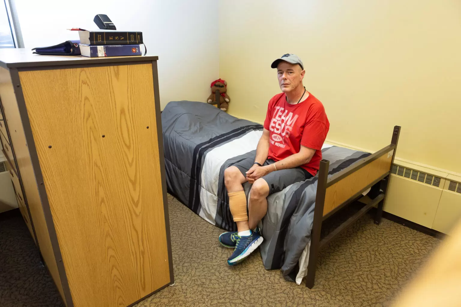 man sitting on a bed